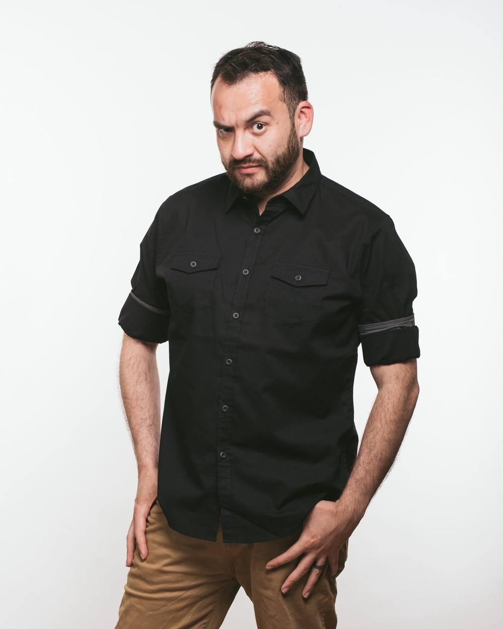 DJ Bash in a playful studio portrait