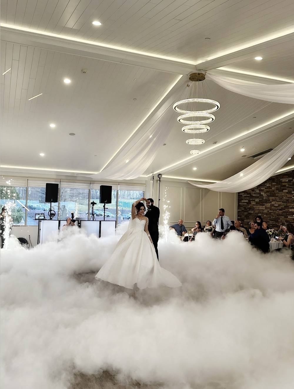 First dance on a floor of white cloud in a bright ballroom