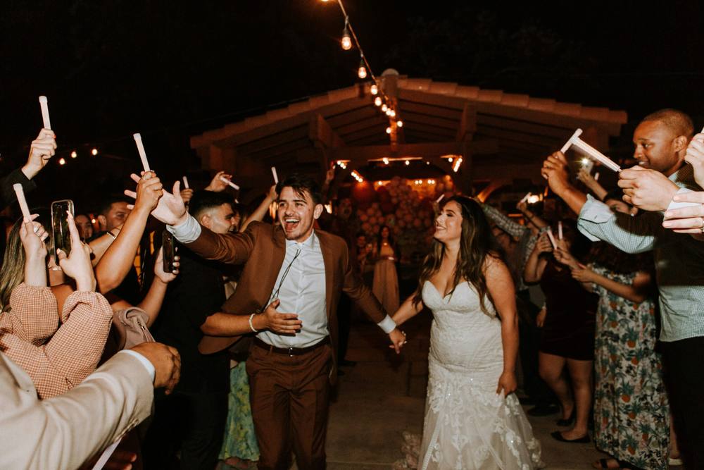 Party guests with hands in the air on the dance floor